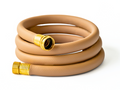 Coiled tan garden hose with brass fittings on a white background